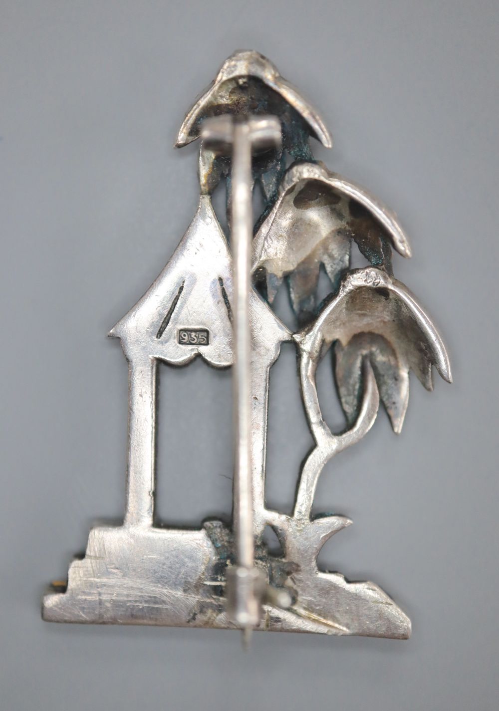 A continental Art Deco 935 white metal and paste set brooch, 34mm, depicting a house with trees, gross 6.1 grams,